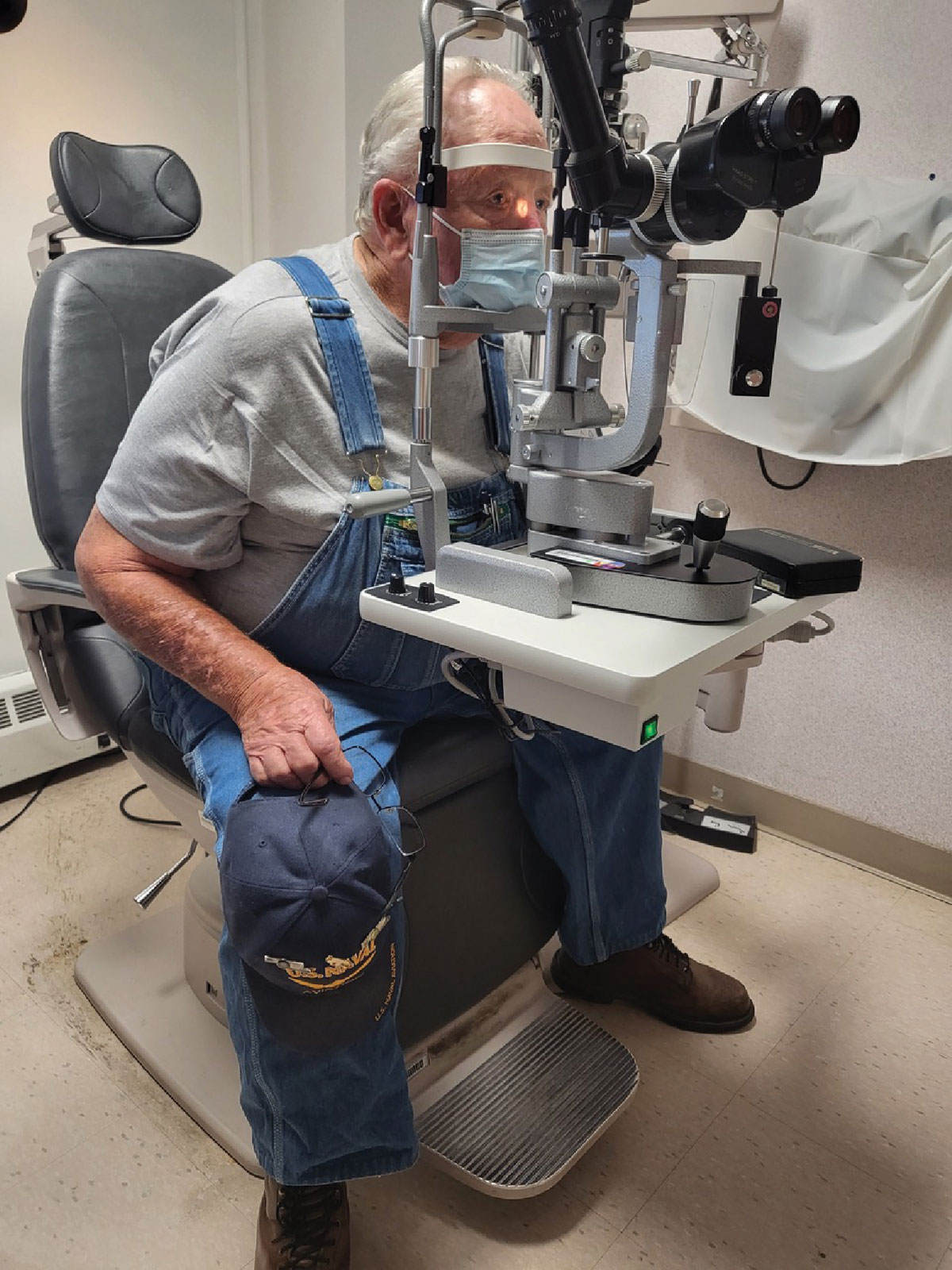 Fig. 1. Ask your patient to spread their legs apart and bend forward at their hips for a more comfortable fit into the slit lamp.